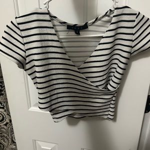 white and black striped crop top, worn slightly,open cleavage